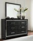 Kaydell King Upholstered Panel Headboard with Mirrored Dresser and Chest