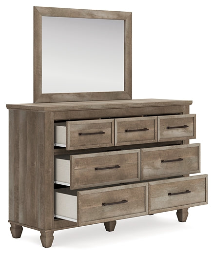 Yarbeck King Panel Bed with Mirrored Dresser, Chest and Nightstand